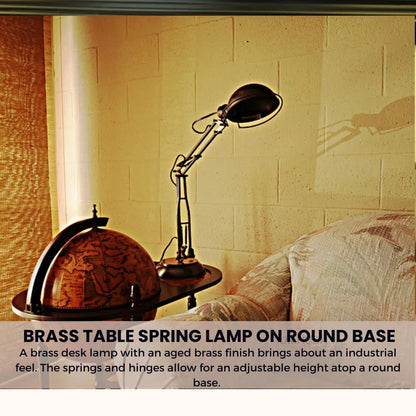 Lampe de table à ressort en laiton sur socle rond