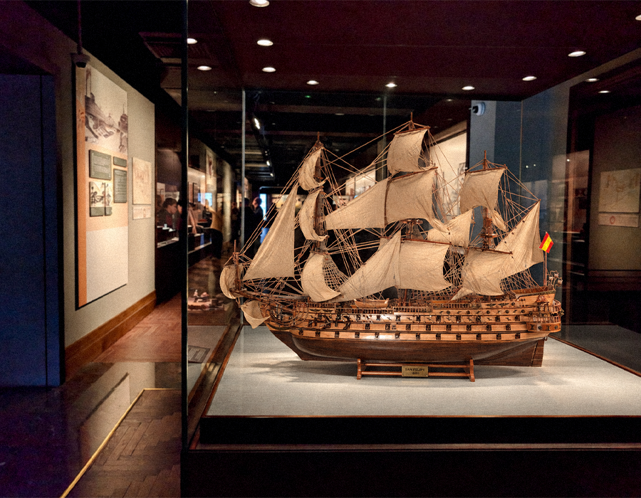 Handcrafted wooden ship model in a museum project setting